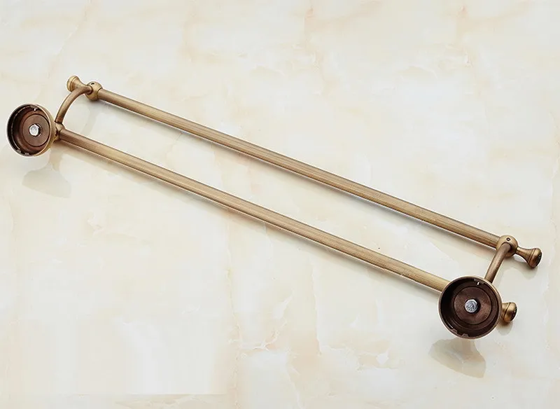 The bathroom uses the old brass two lane towel hung on the wall, the bathroom towel rack