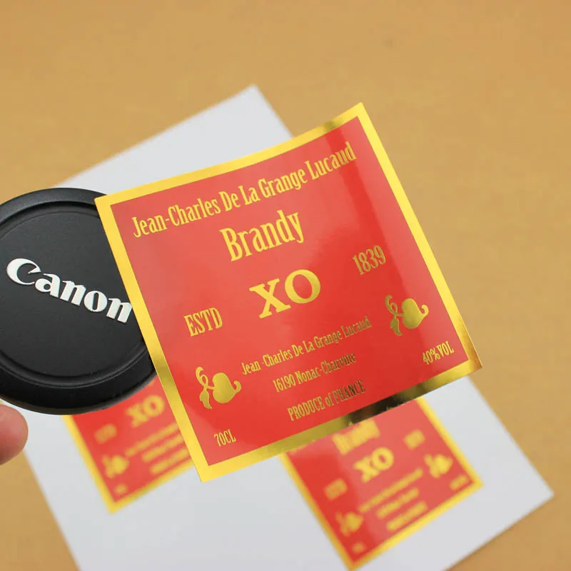 

Bulk Custom Brand Name Eco Friendly Hot Stamping Gold Foil Printing Adhesive Paper Stickers Labels