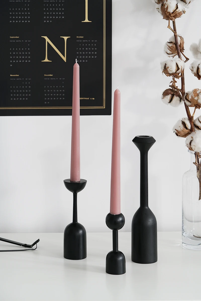 black wooden candle holders
