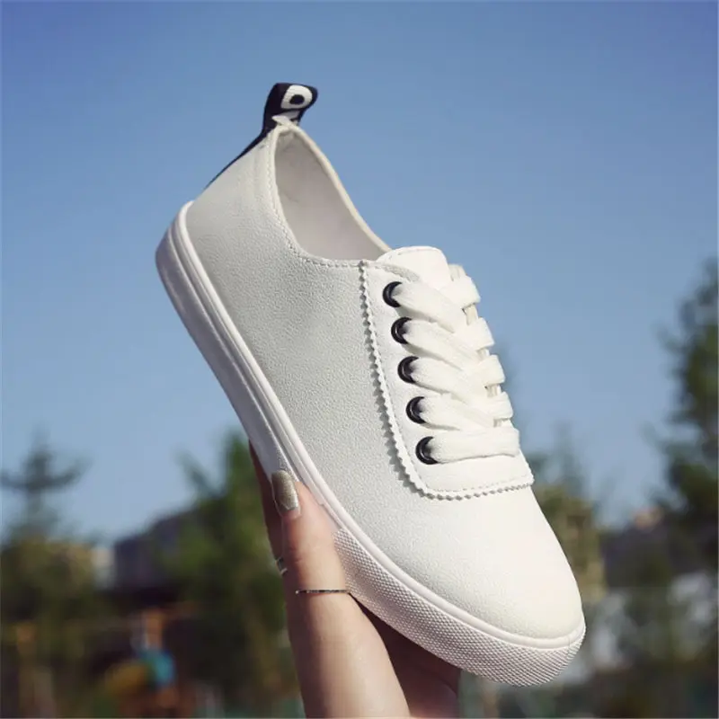 white flat tennis shoes
