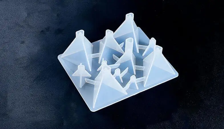 

A pyramid shaped silicone mold made of epoxy resin can be used for DIY mold gypsum handicraft ornaments