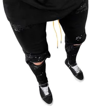 black pants with holes in them