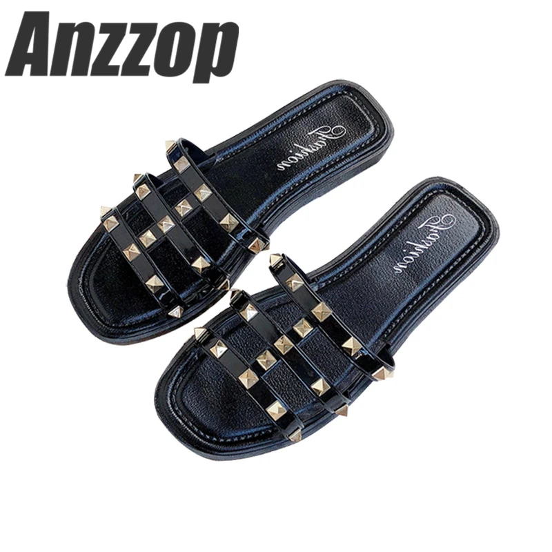 

Slippers female summer fashion wear 2019 new word ins net red wild flat rivet Roman seaside beach sandals and slippers hot