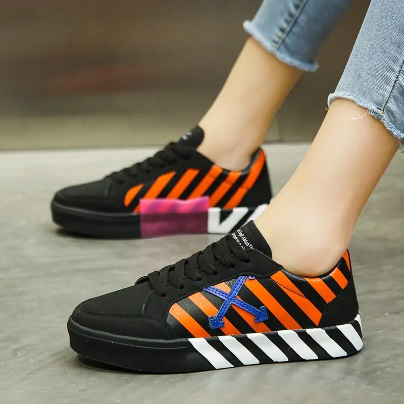 

2020 Zebra Striped Sneakers Men Women Lover Pu Canvas Arrow Skateboarding Shoe Street Trendy Designer EU 36-45 Zapatillas Hombre