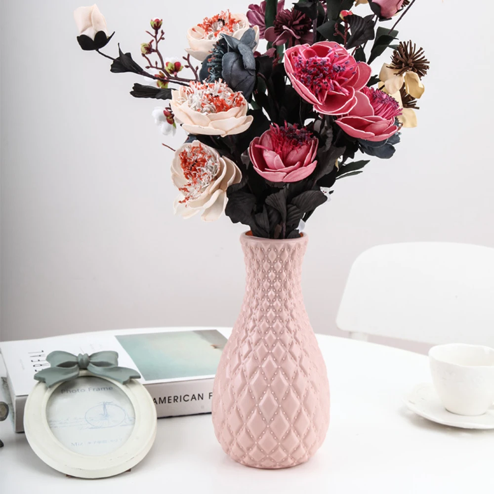 Crafted with precision and inspired by Nordic styles, the Unbreakable Plastic Flower Vase enhances your interior design effortlessly. The stark white shade replicates the sophistication of ceramic, promising not just charm but durability. • Colma.do™ • 2023 •