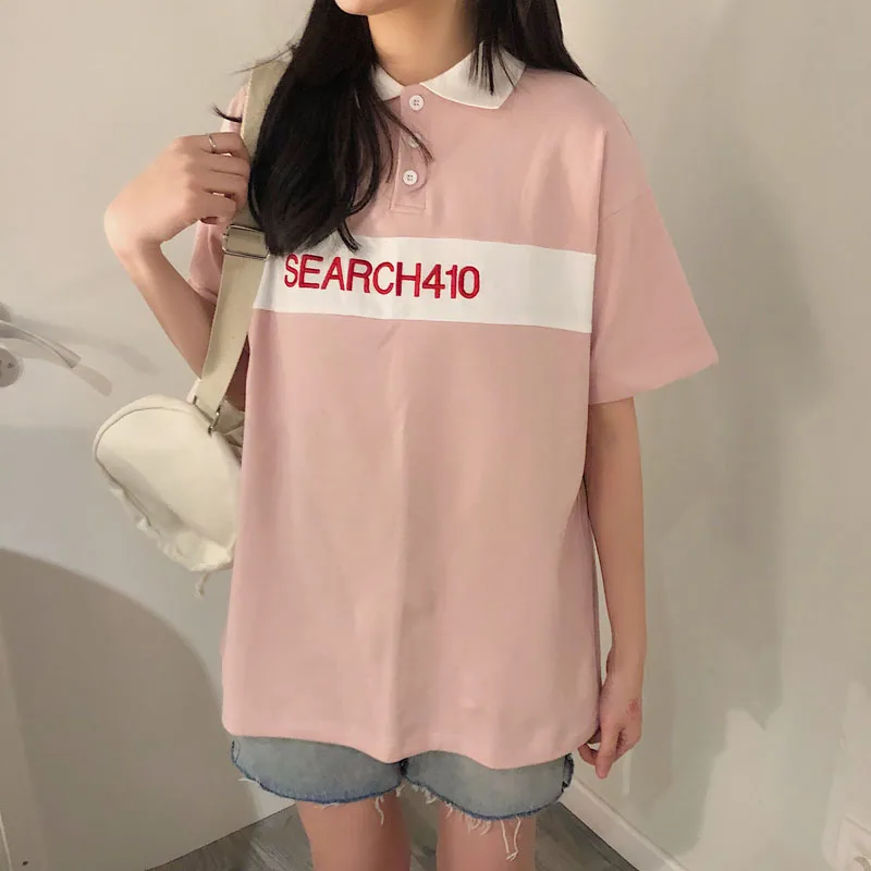 camisa polo rosada de mujer