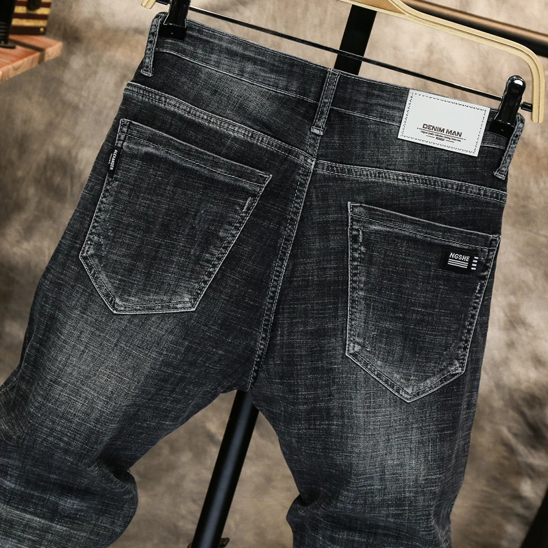 Seller 2020 spring and summer Washed denim plus size men's ripped jeans men's loose frayed nine-point pants Black light-colored harem