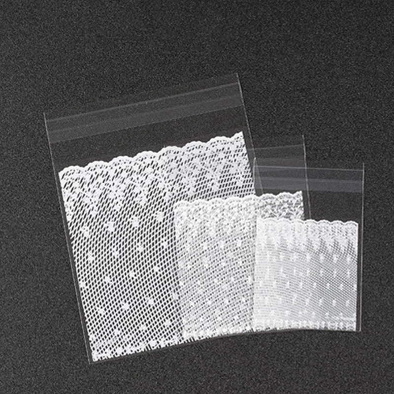 100pcs-plastic-transparent-white-lace-candy-biscuit-gift-bag-and-DIY-self-adhesive-bag-wedding-birthday.jpg_Q90.jpg_.webp