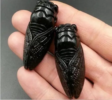 hand carved cicada amulet pendant 