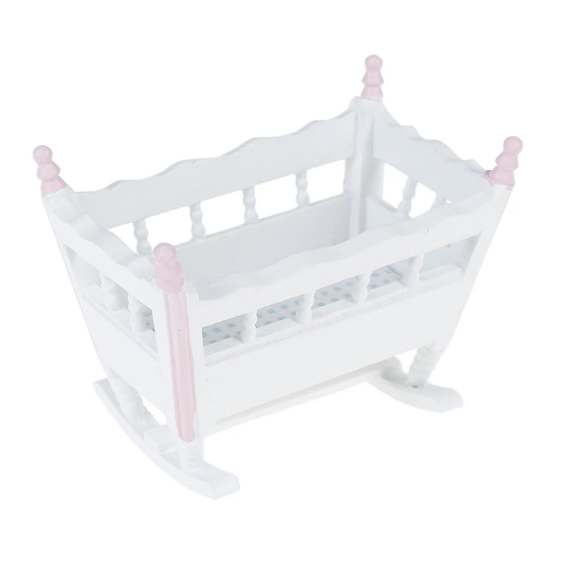 white wooden cradle