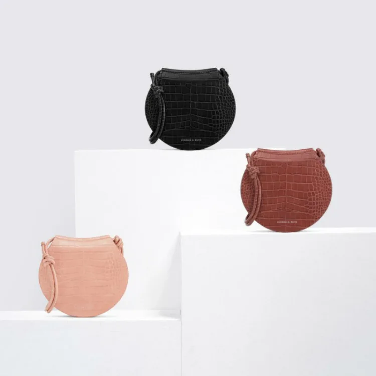 

Singapore 2020 Small Ck2-80270295 Single Shoulder Slung Round Cake Embossing Saddle Bag Female