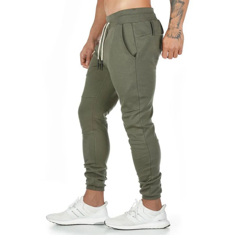 green solid color Новые высококачественные мужские брюки для фитнеса, повседневные Стрейчевые штаны, одежда для бодибилдинга, повседневные спортивные штаны для бега, брендовые штаны - Цвет: green solid color