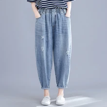 Real shot spring new women's wash water denim pocket solid color hole elastic nine points harem pants wild