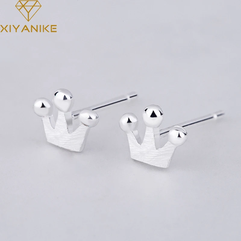 

XIYANIKE 925 Sterling Silver New Fashion Korean Style Crown Stud Earrings For Women Small Simple Ear Hoops Jewelry Couple Gift