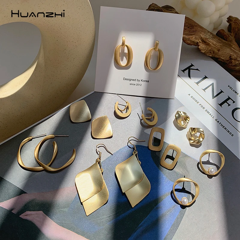 

HUANZHI Korean 2019 Geometric Hollow Splice Irregular Distortion Gold Metal Simple Stud Earrings for Women Girls Travel Jewelry