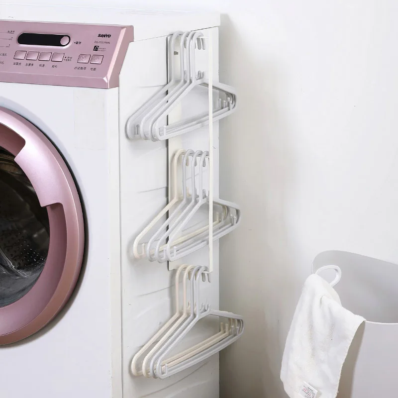 

Tieyi perforation-free wall multi-layer clothes rack receiving rack