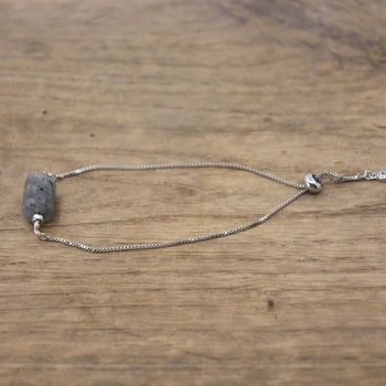 Labradorite crystal bracelet is to visually showcase the inherent beauty and unique characteristics of this mesmerizing gemstone accessory. Labradorite, with its iridescent flashes and captivating play of colors, symbolizes transformation and spiritual growth. The image aims to convey the bracelet's aesthetic appeal, inviting individuals to explore the mystique of Labradorite and consider it not only as a stylish adornment but also as a potent tool for enhancing intuition, promoting balance, and connecting with higher consciousness. Whether worn for its metaphysical properties or simply admired for its natural allure, the image serves to captivate attention and inspire a deeper appreciation for the transformative energy that Labradorite embodies.