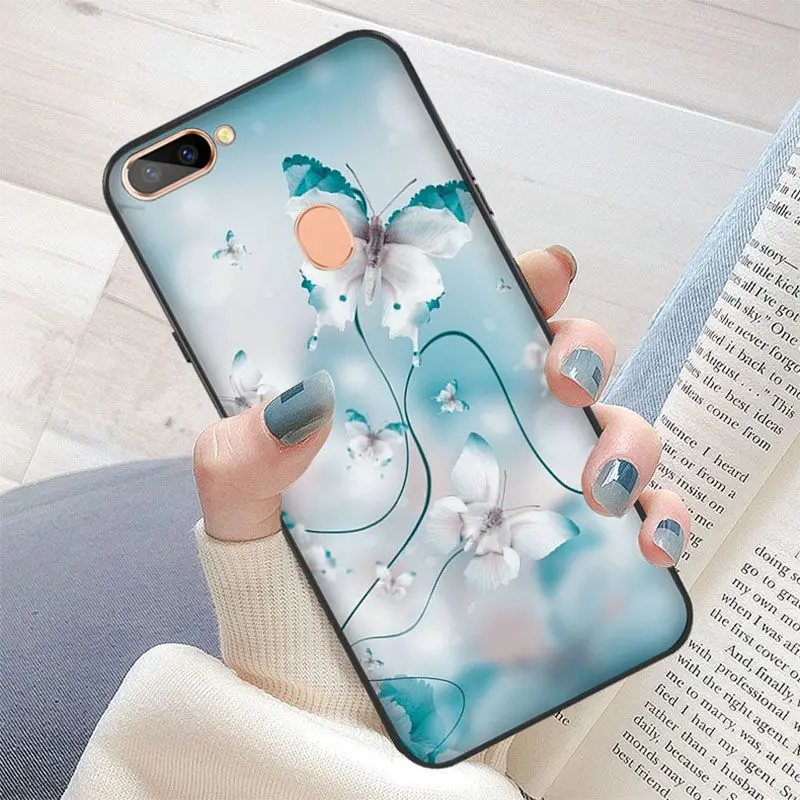 Red butterfly on white roses flower