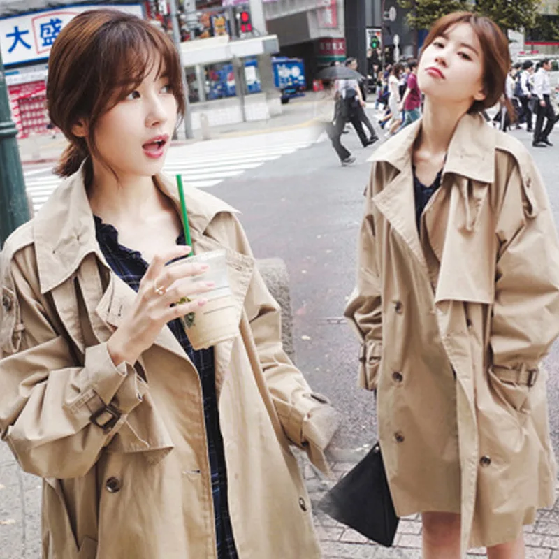 

2019 women autumn new solid color stand collar windbreaker jacket Korean version of the long section waist tie woman windbreaker