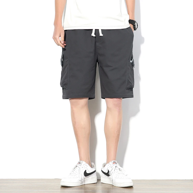 Pantalones cortos de talla grande para hombre, shorts holgados de color sólido, ropa deportiva para correr, monos de personalidad informales de verano, 2021