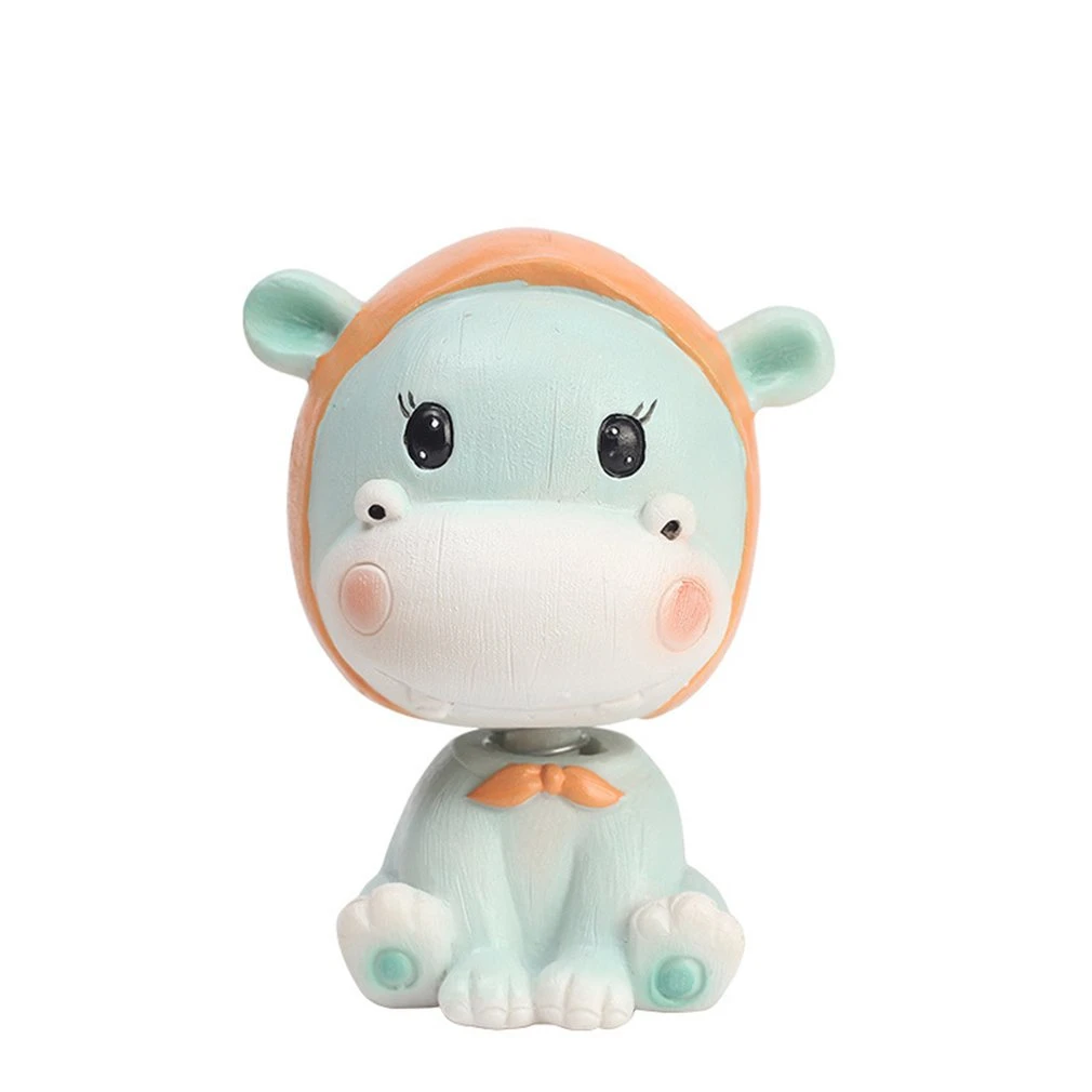 cow with toy car on head