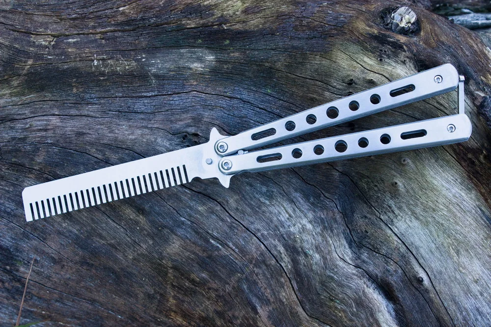 https://ae01.alicdn.com/kf/H42fe47207ed647eb90f25099f632be1bX/Foldable-Stainless-Steel-Knife-Comb-Tool-Silver-Black-Practice-Butterfly-Knife-Trainer-Training-Knife-Dull-Tool.jpg