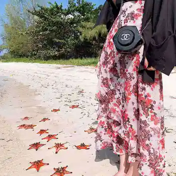 

UNIFREE 2020 spring new mid-length simple chiffon floral print elegant skirt U192EEQ162