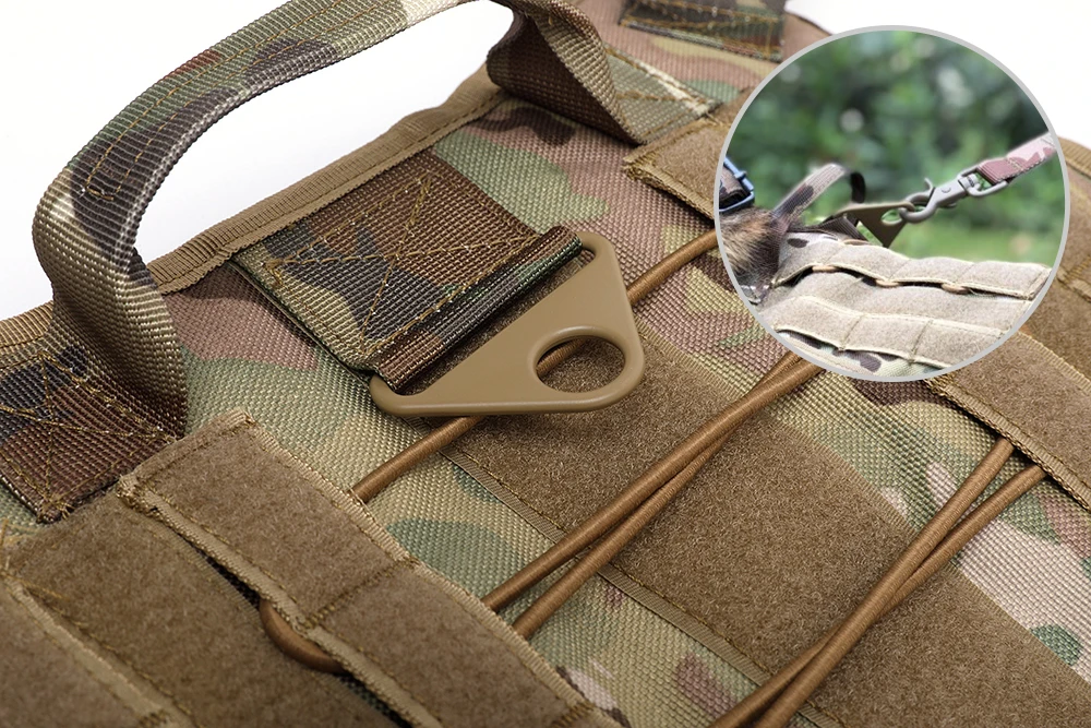 A close-up of a camouflaged Tactical Dog Harness & Leash Set by The Stuff Box with a metal ring and various straps. Inset shows a carabiner clip attached to the same strap system, highlighting its MOLLE System compatibility.