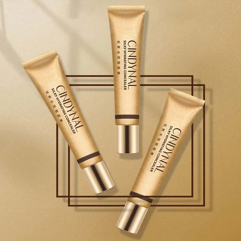 Small golden tube silky moisturizing nourishing concealer foundation cream to cover freckles acne spots and dark circles makeup