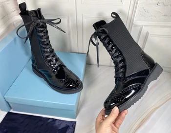 

Female cow patent leather leather and imported pure wool wool stitching retro carved wool boots