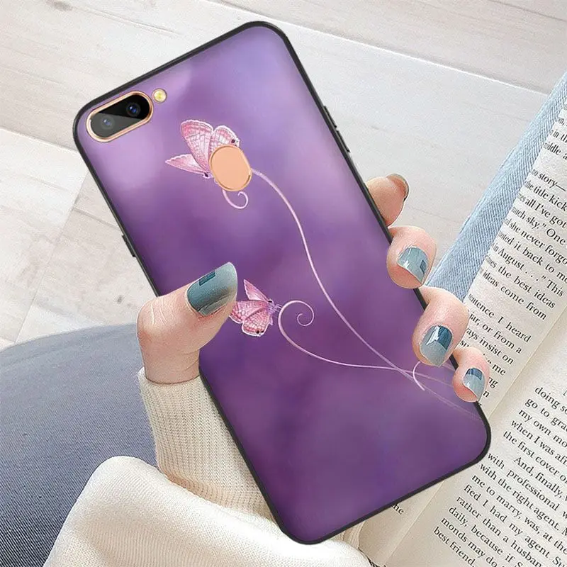 Red butterfly on white roses flower