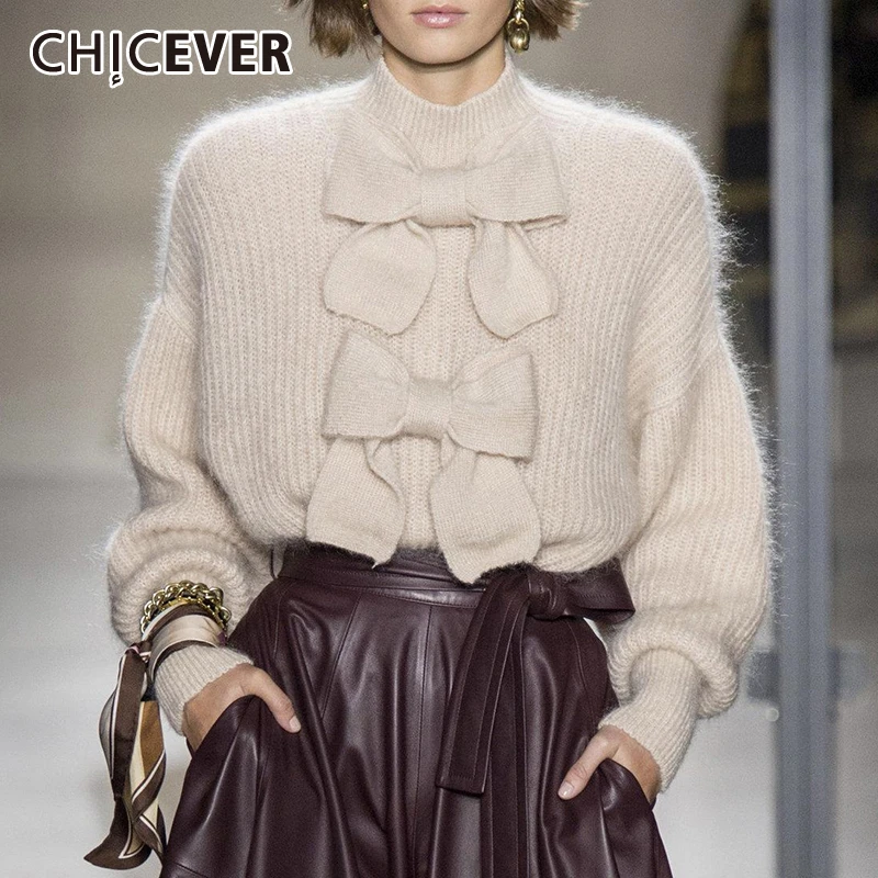 Comprar CHICEVER sólido Bowknots tejer suéter mujeres cuello alto linterna manga suelta Casual suéter mujer 2019 otoño nuevo