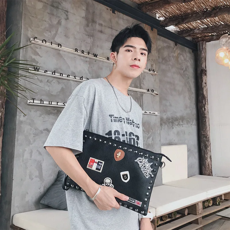 

Original wholesale new Korean version of black rivet clutch handbag shoulder Messenger bag file tide bag