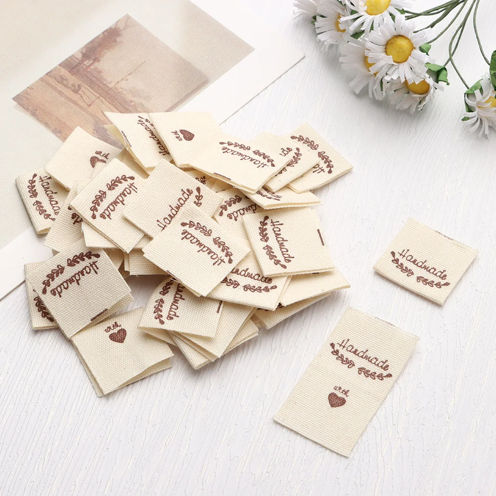 Description Picture 6 of item50PCS Heart Shape Cloth Garment Labels Cartoon Pattern Handmade With Love Clothing Tags Woven Knitted Supplies Sewing Accessory