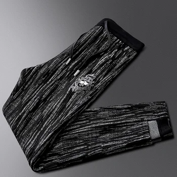 

Autumn and winter new personality black and gray striped casual pants men's fashion youth drawstring sports pants tide