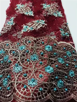 

latest styles designed in African wine red lace fabrics with beads Nigerian wedding dresses in French mesh lace fabrics stone