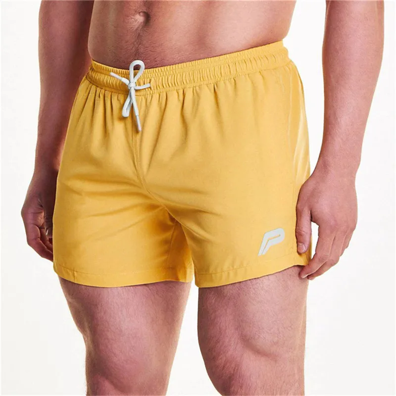 Мужские дышащие шорты для фитнеса бодибилдинга модные повседневные тренажерные залы Мужская тренировка для бегунов брендовые пляжные тонкие короткие брюки размер m-xxl - Цвет: yellow