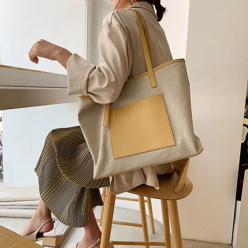 

Korean minority design new minimalist PU splicing canvas single shoulder large bag handbag handheld commuting Totte