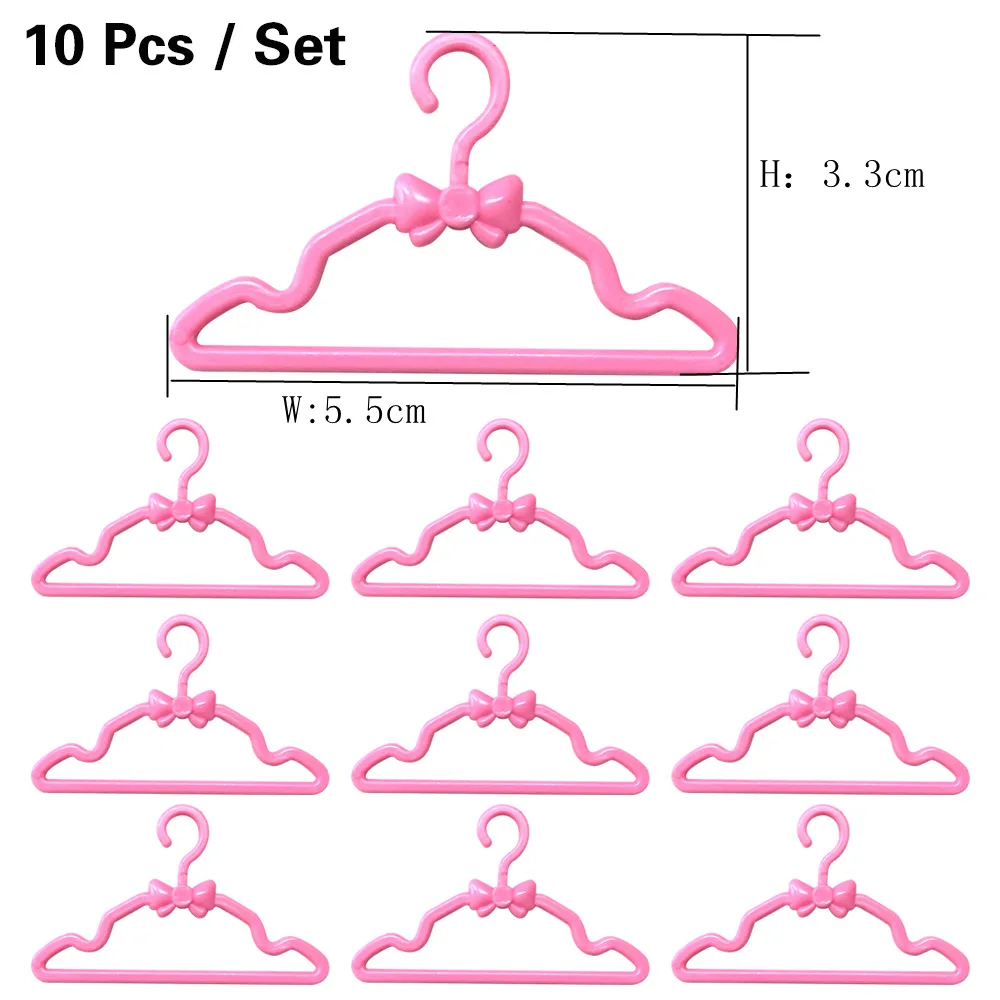 

NK 10 Pcs/Lot Mini Doll Plastic Pink Hangers Cute Coat Pants Clothes Holder For Barbie Dolls Accessories Baby Toys