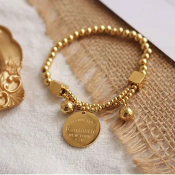 

Elastic gold beaded bracelet for women stainless steel wholesale coin letter disc charm bracelet fashion dainty 2020