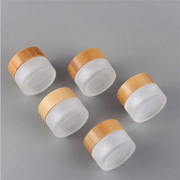 

Wholesale Luxury Frosted Glass Cosmetic Jars with Bamboo Lid Empty Matte Clear Cosmetic Glass Cream Jar 15g 30g 50g 100g 200g