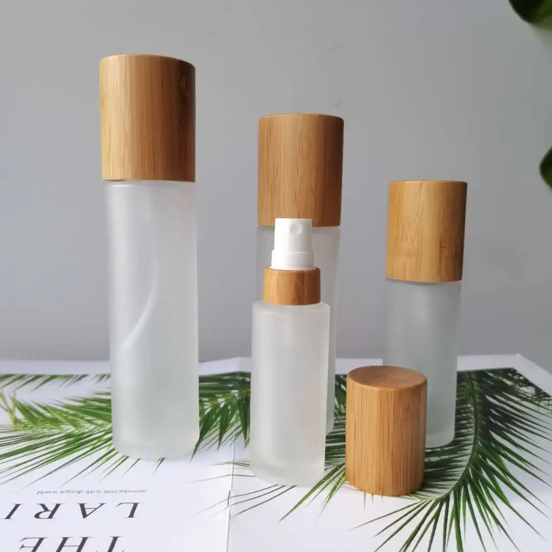 Frosted glass cosmetic bamboo cap bottle with spray glass pump bottles for cosmetics packages 100ml 120ml 150ml engraving logo