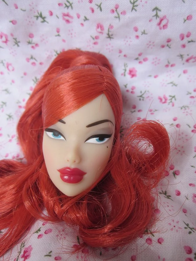old doll with red hair