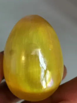 

Polished white selenite egg plating yellow satin crystal gypsum healing crystal Morocco free stand