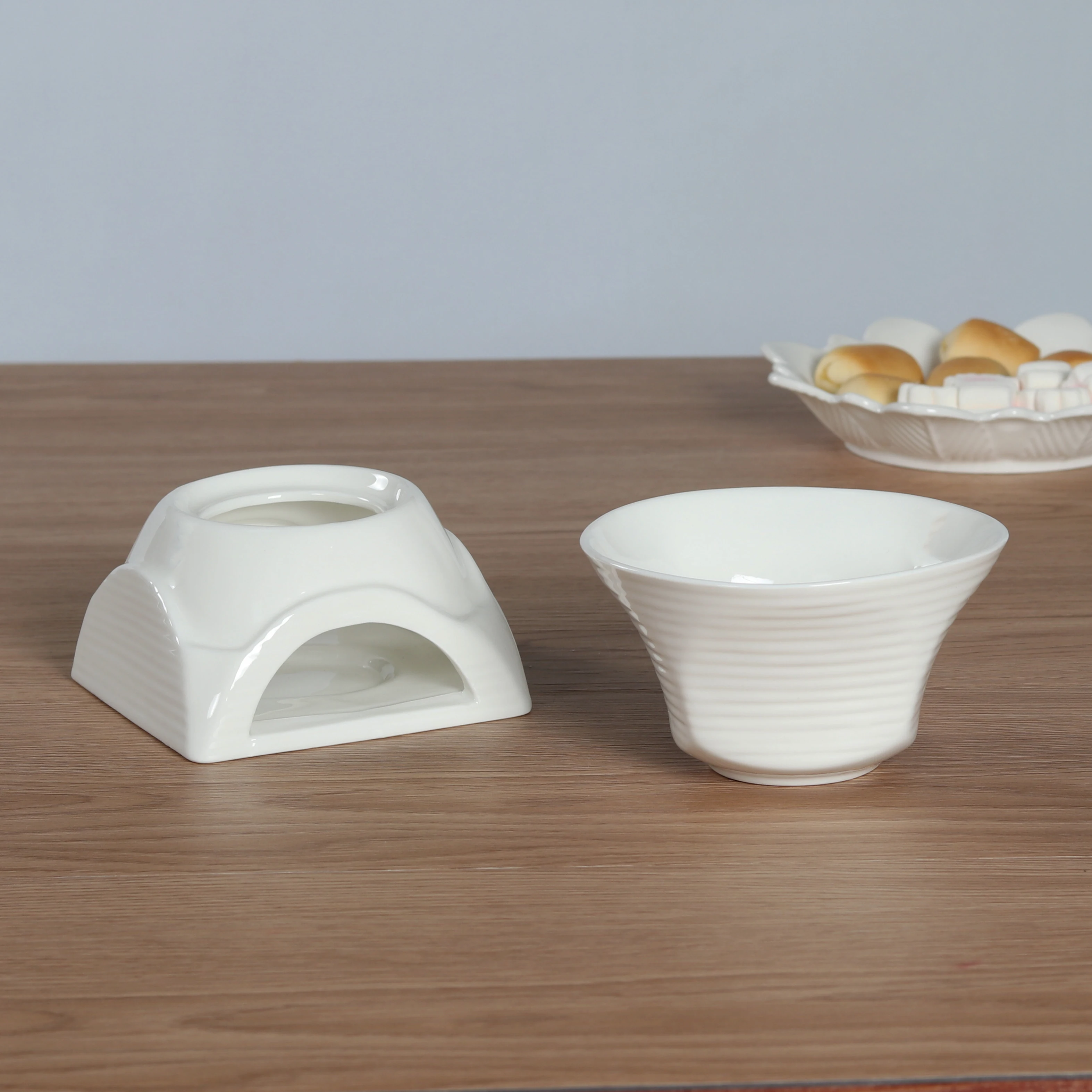 White ceramic fondue pot for chocolate and cheese melting