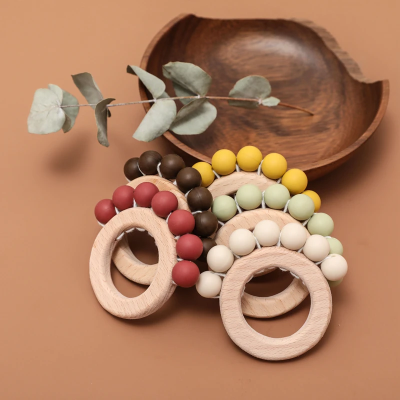

Food Grade Baby Teethers Wood Rings Bpa Free Silicone Rodent Teething Baby Toys Feeding Bracelet Pendant Newborn Wooden Rattle