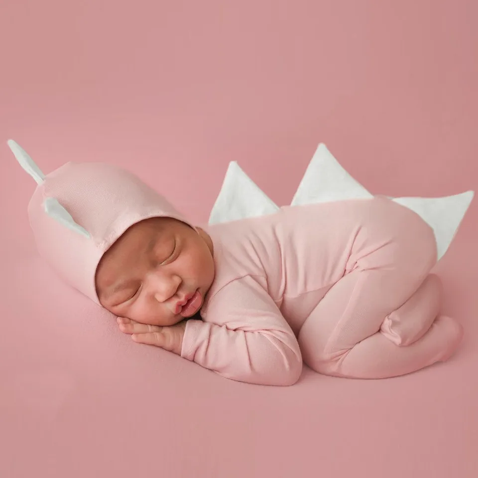 pink dinosaur baby grow