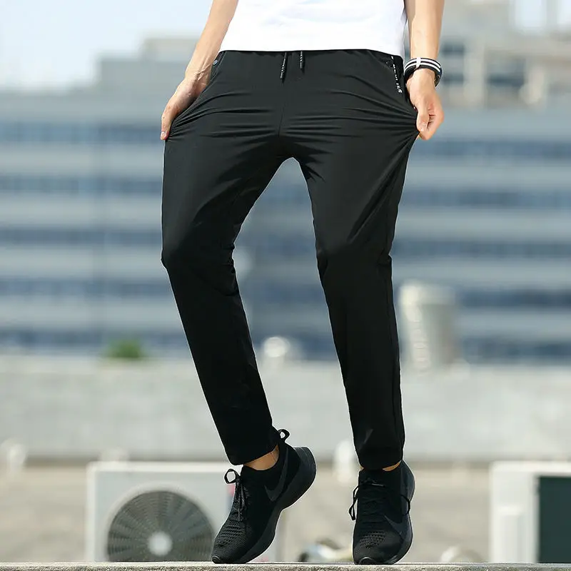 

Autumn ultra thin large ice silk elastic pants men's casual pants loose sports pants small leg pants elastic Leggings