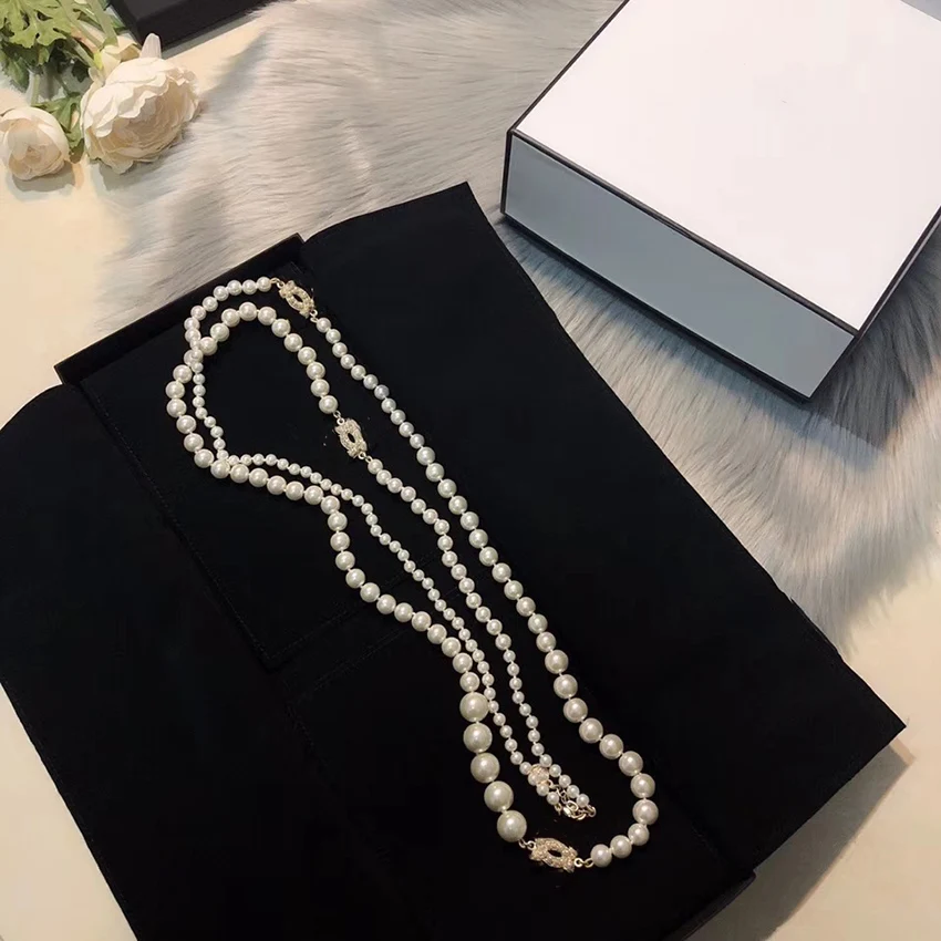 

Delicate sweater chain. Fashion long women's double necklace. Attend banquets and Party accessories. Natural Pearl jewelry.