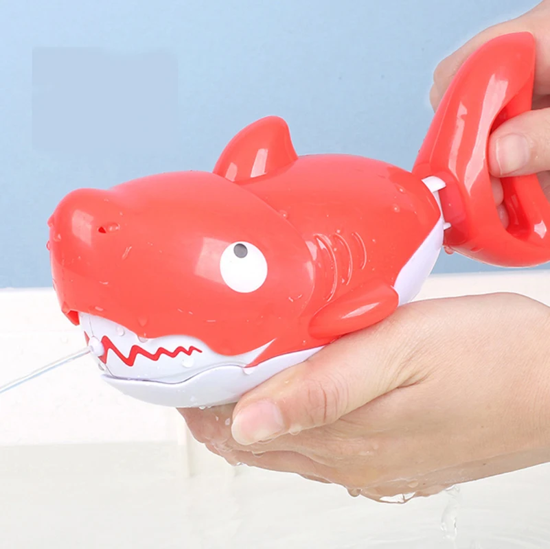 

Explosion models stay cute and intelligent swimming pig + hand shark spray toy children's toys swimming pig baby bath toys